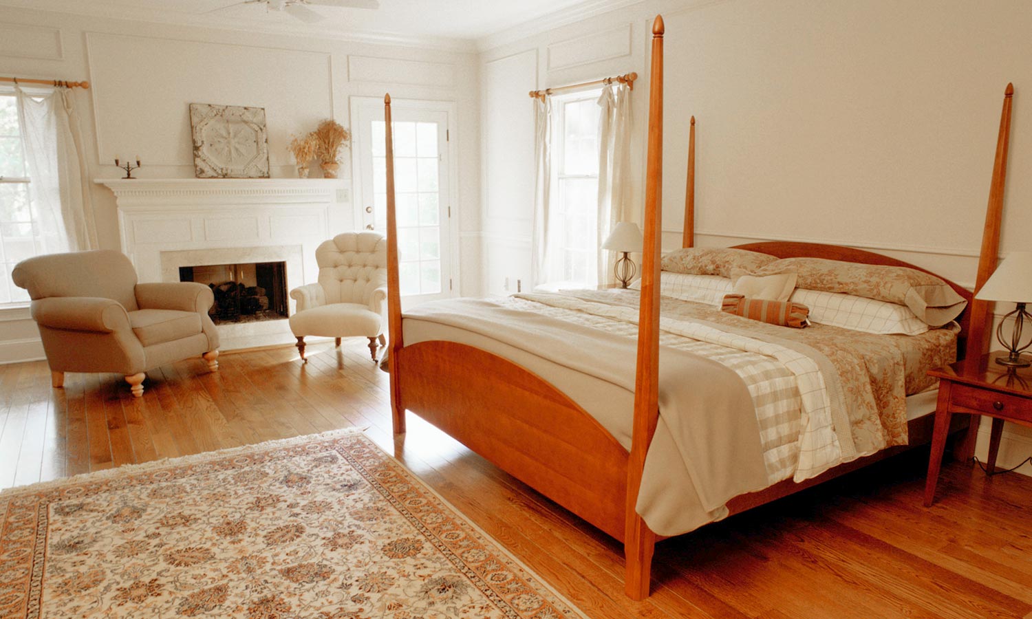 guest bedroom with seats and a fireplace