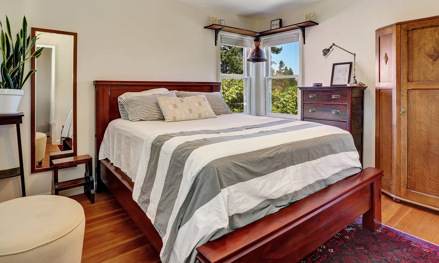 bedroom with a full length mirror