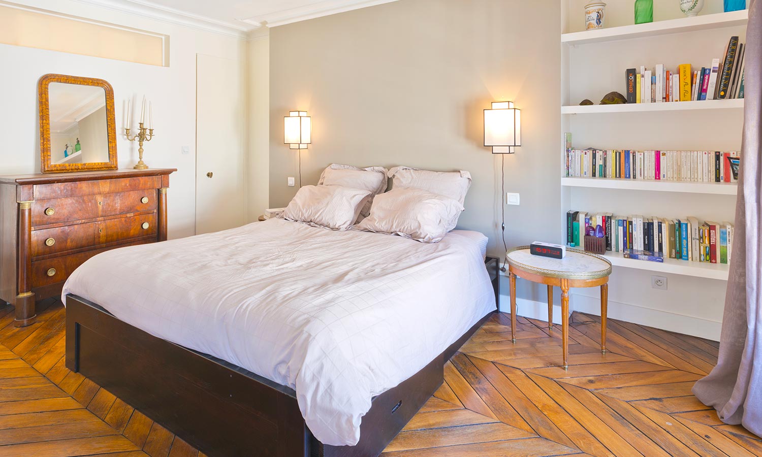 guest bedroom with a bookshelf 