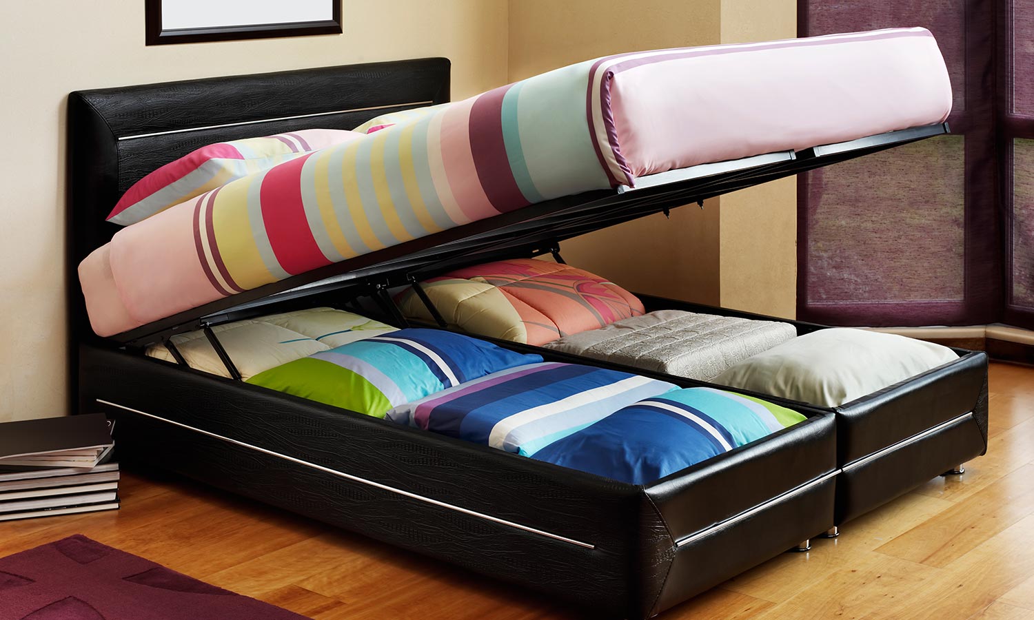 An ottoman bed with the mattress lifted to expose the storage underneath.