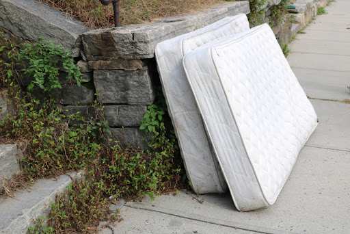 Two old mattresses left in front of the house