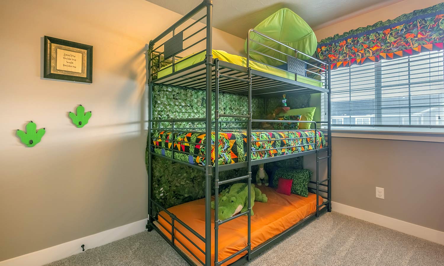 A bunk bed with three beds stacked on top of each other