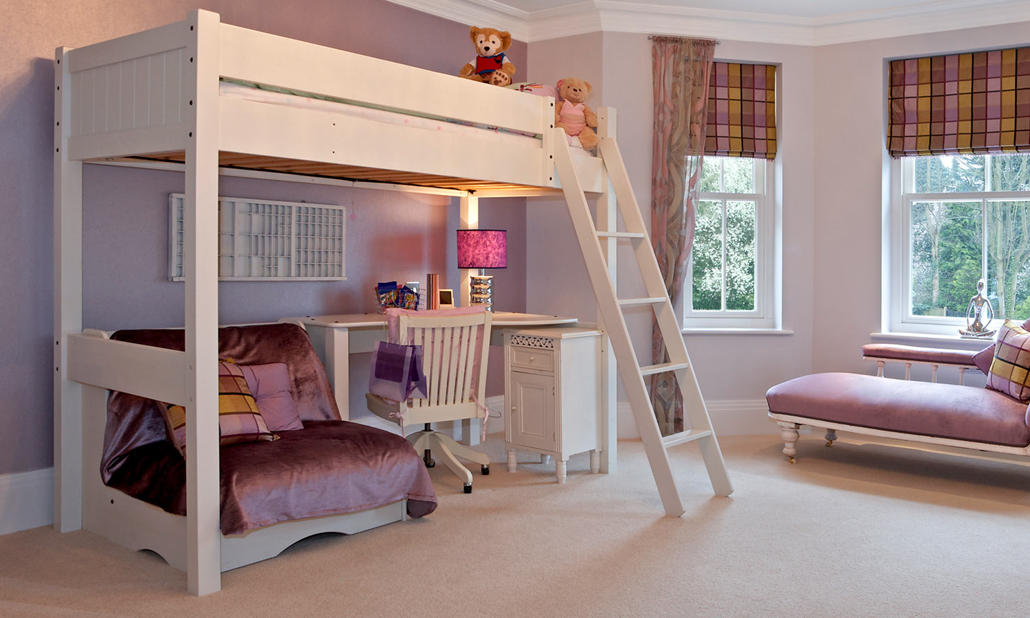 A lofted bed with a play area underneath