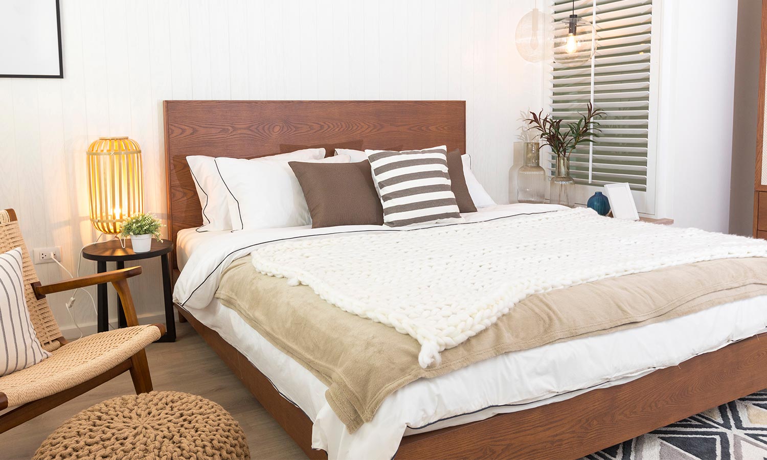 A wooden bed frame with a tall headboard.