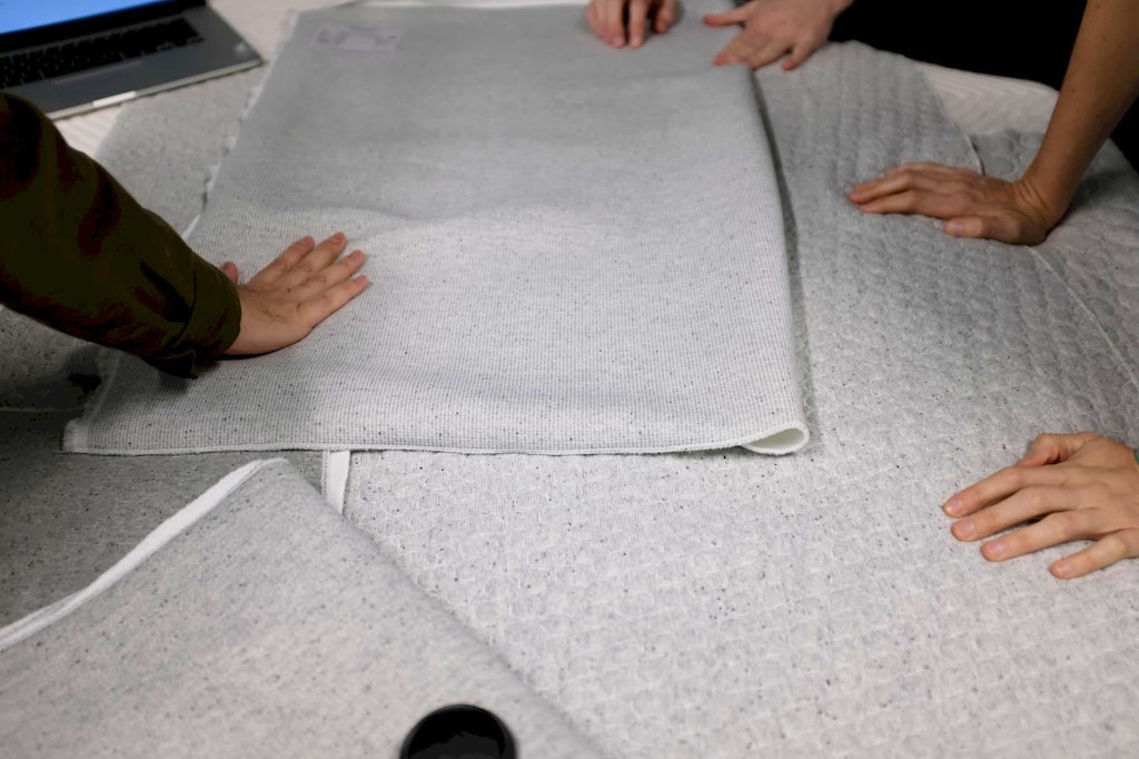 People handling textiles at Casper Labs