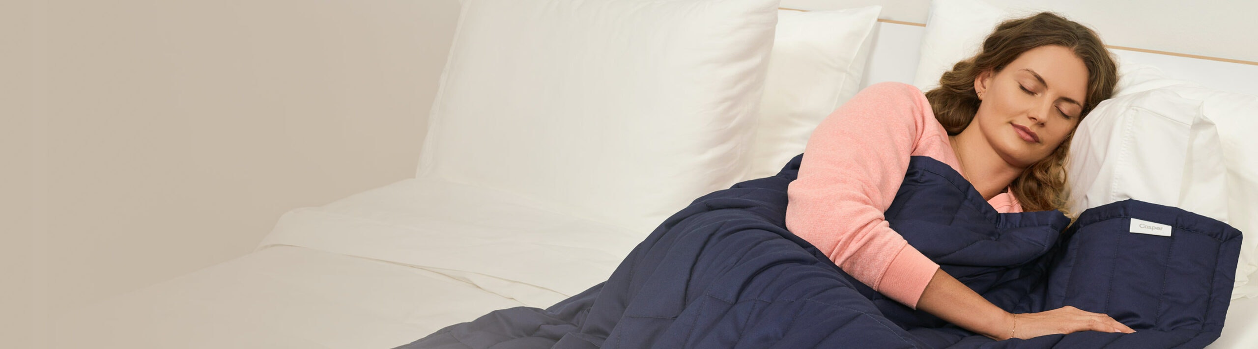 woman sleeping with a weighted blanket