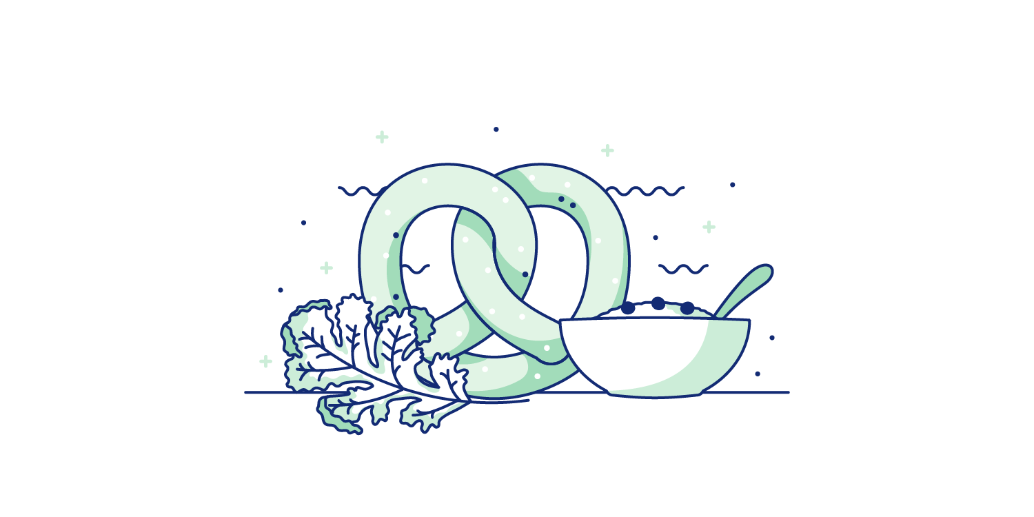 Pretzels, oatmeal, and kale spread out onto a table. Illustration