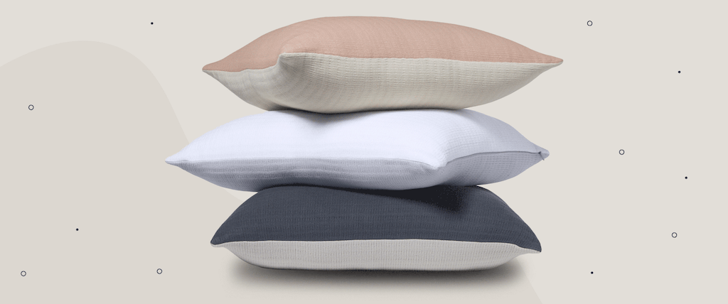 Pillows stacked on top of one another.