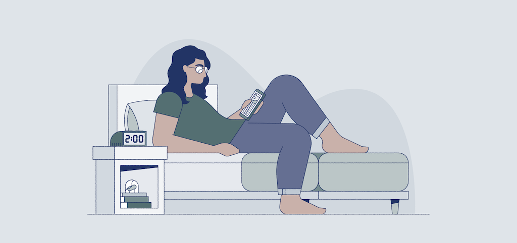 woman procrastinating bedtime on her phone